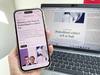 Blick auf Smartphone und Laptop die einen Gastkommentar im Handelsblatt von Michael Böhmer und Henning Vöpel zeigen
