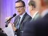 Nahaufnahme von Michael Böhmer im Panel mit Mikrofon